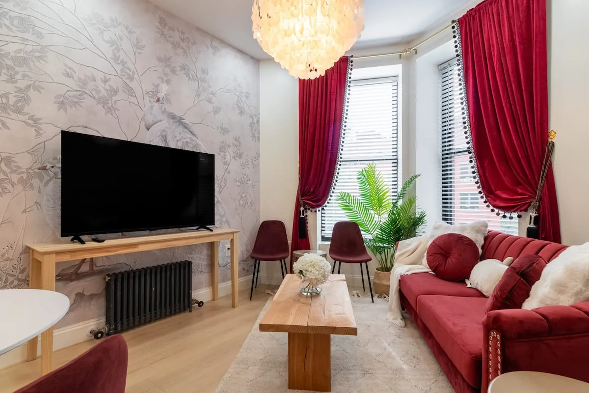 Bedroom styled with warm neutral furnishings and classic renovation details